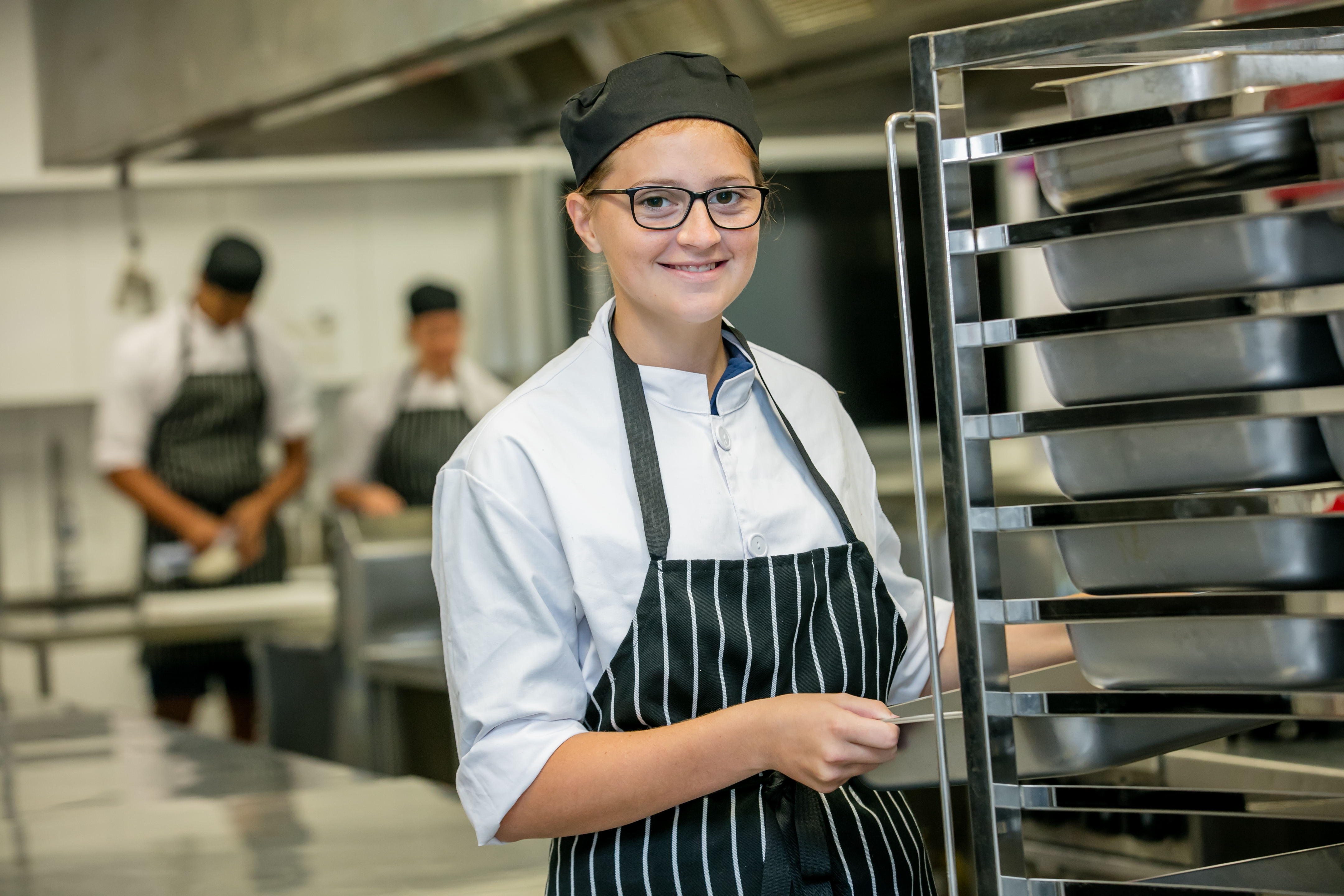 A student undertaking work in a bakery.